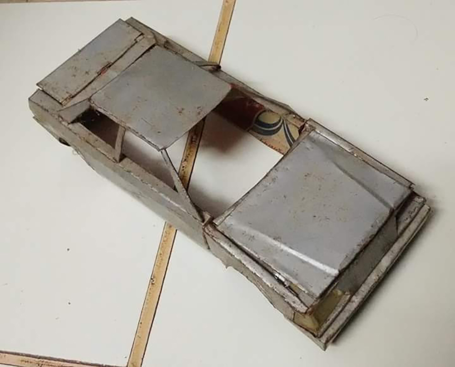 A powder tin metal Car body with opening hood and hatch and working lights